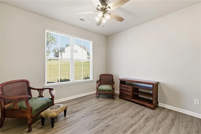 a living room with furniture and a window