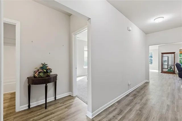 a room with a bench and wooden floor