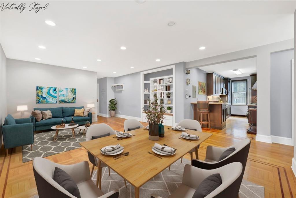 a dining room with furniture and wooden floor