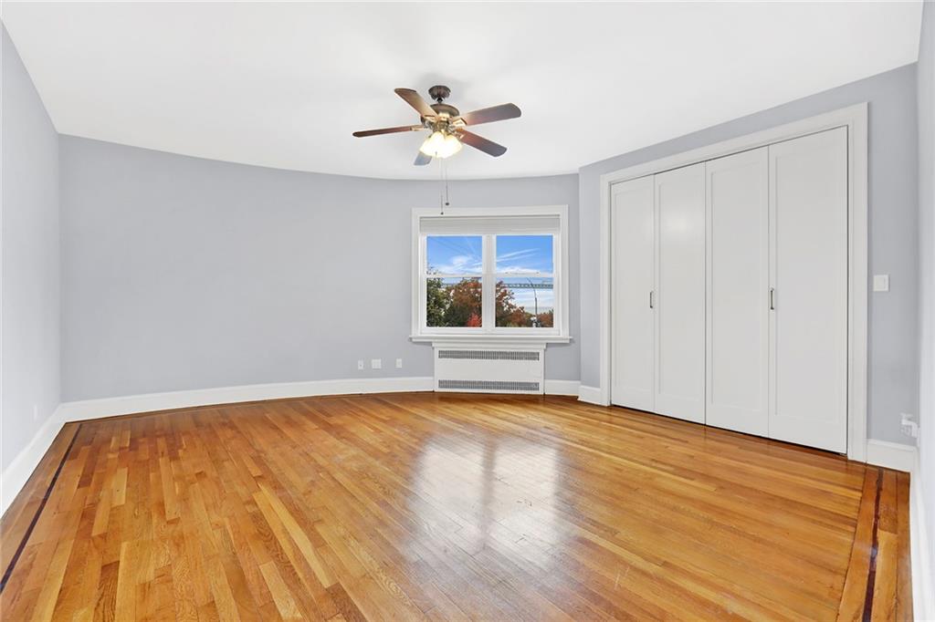 9615 Shore Road, Unit 3A Brooklyn, NY 11209 - Photo 11 of 14 a view of an empty room with wooden floor and a window