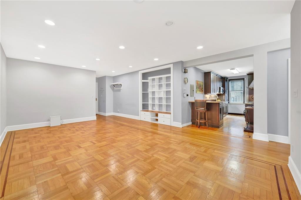 9615 Shore Road, Unit 3A Brooklyn, NY 11209 - Photo 2 of 14 a view of an empty room with kitchen and window