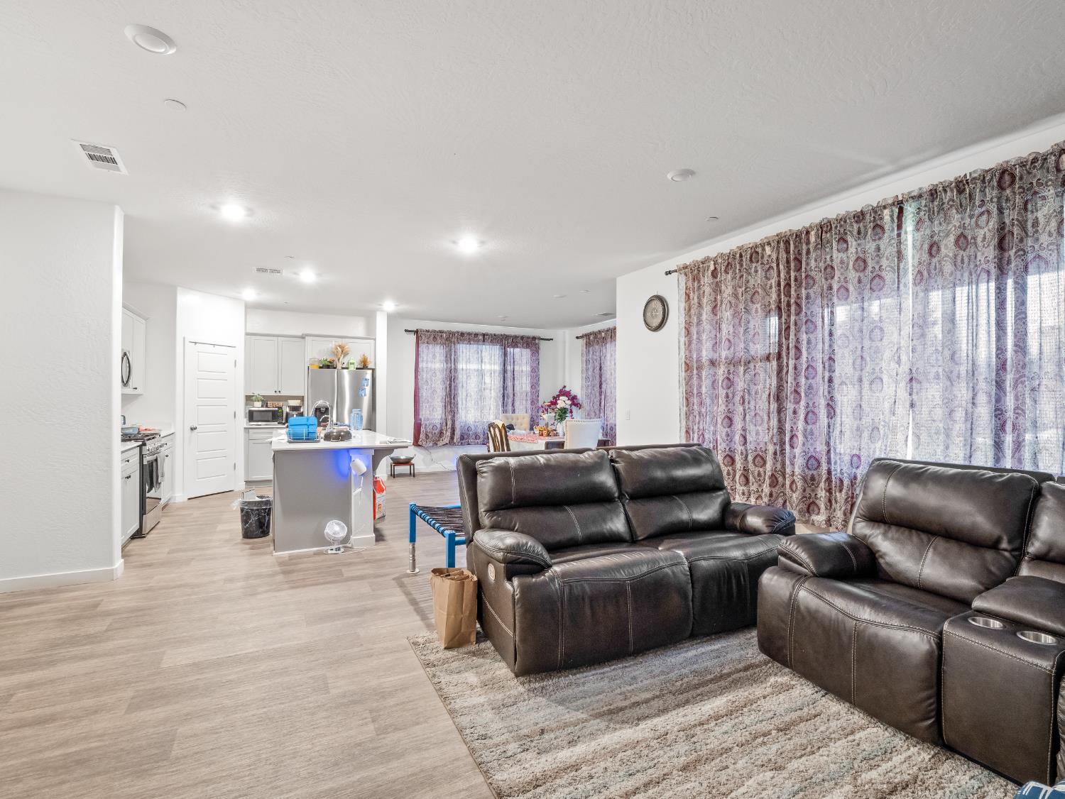 5958 West Austin Way Fresno, CA 93722 - Photo 11 of 18 a living room with furniture and a large window