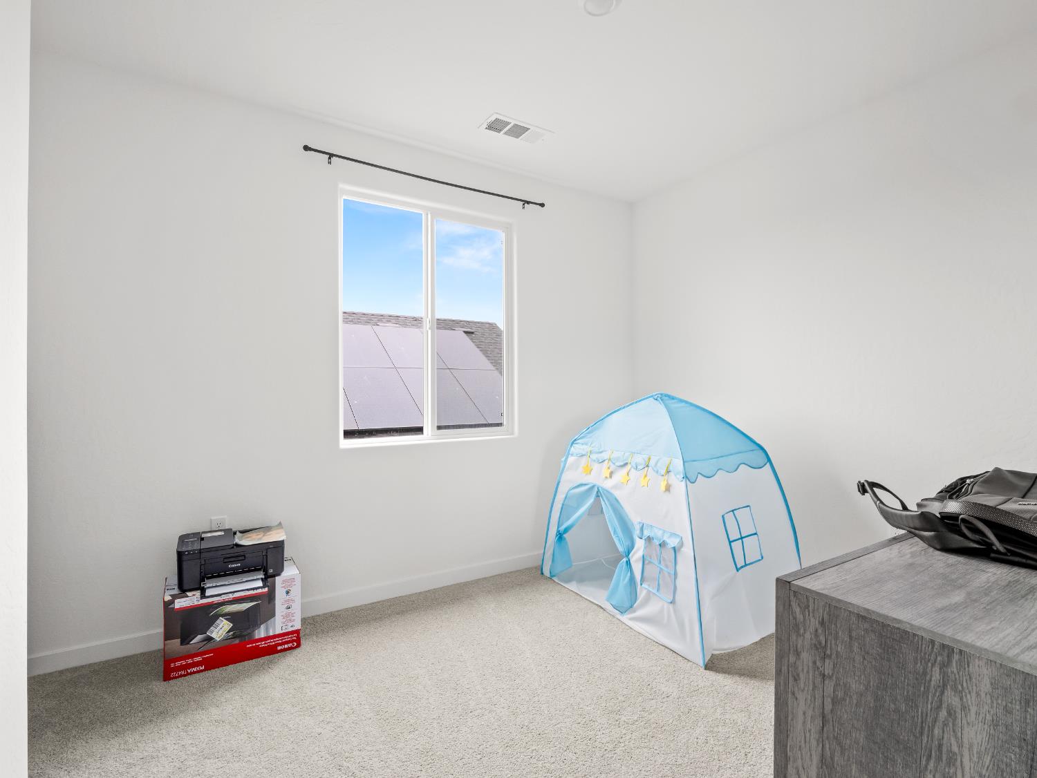 5958 West Austin Way Fresno, CA 93722 - Photo 16 of 18 a bedroom with a bed and a window