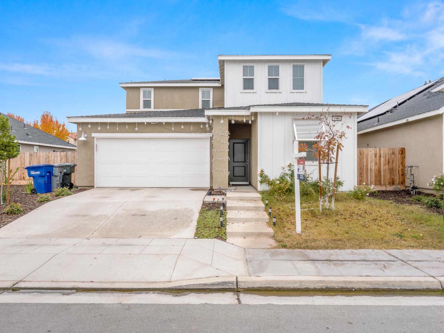 5958 West Austin Way Fresno, CA 93722 - Photo 3 of 18 a front view of house with yard