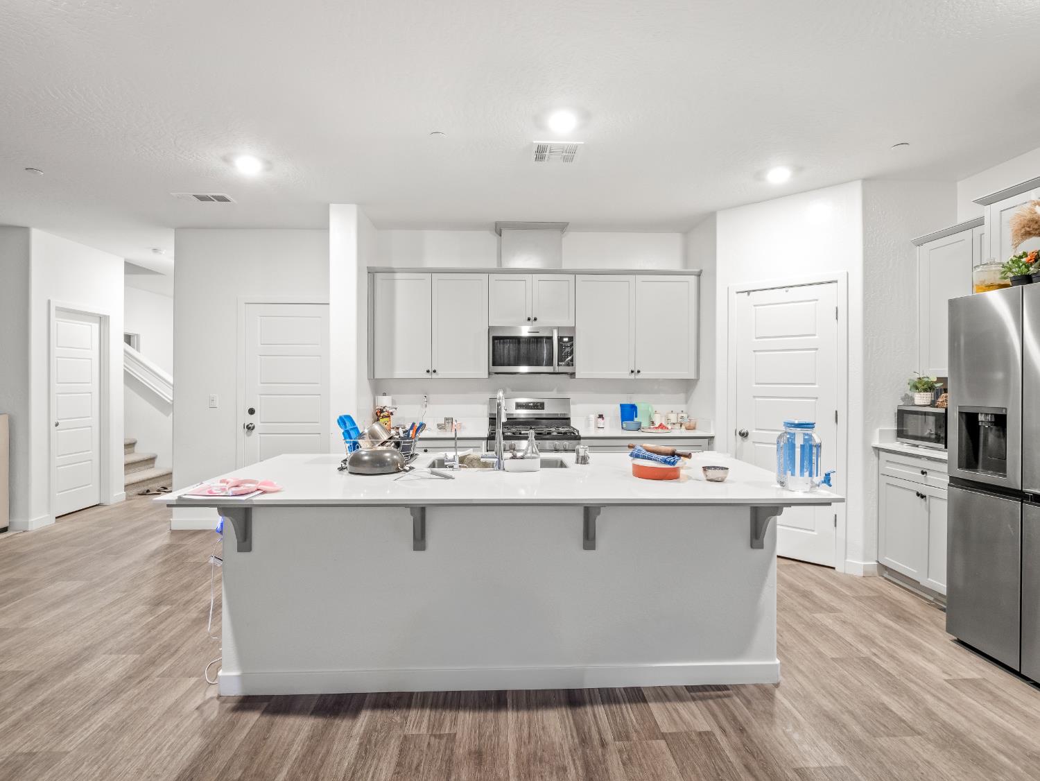 5958 West Austin Way Fresno, CA 93722 - Photo 8 of 18 a view of kitchen with stainless steel appliances granite countertop a sink stove and refrigerator
