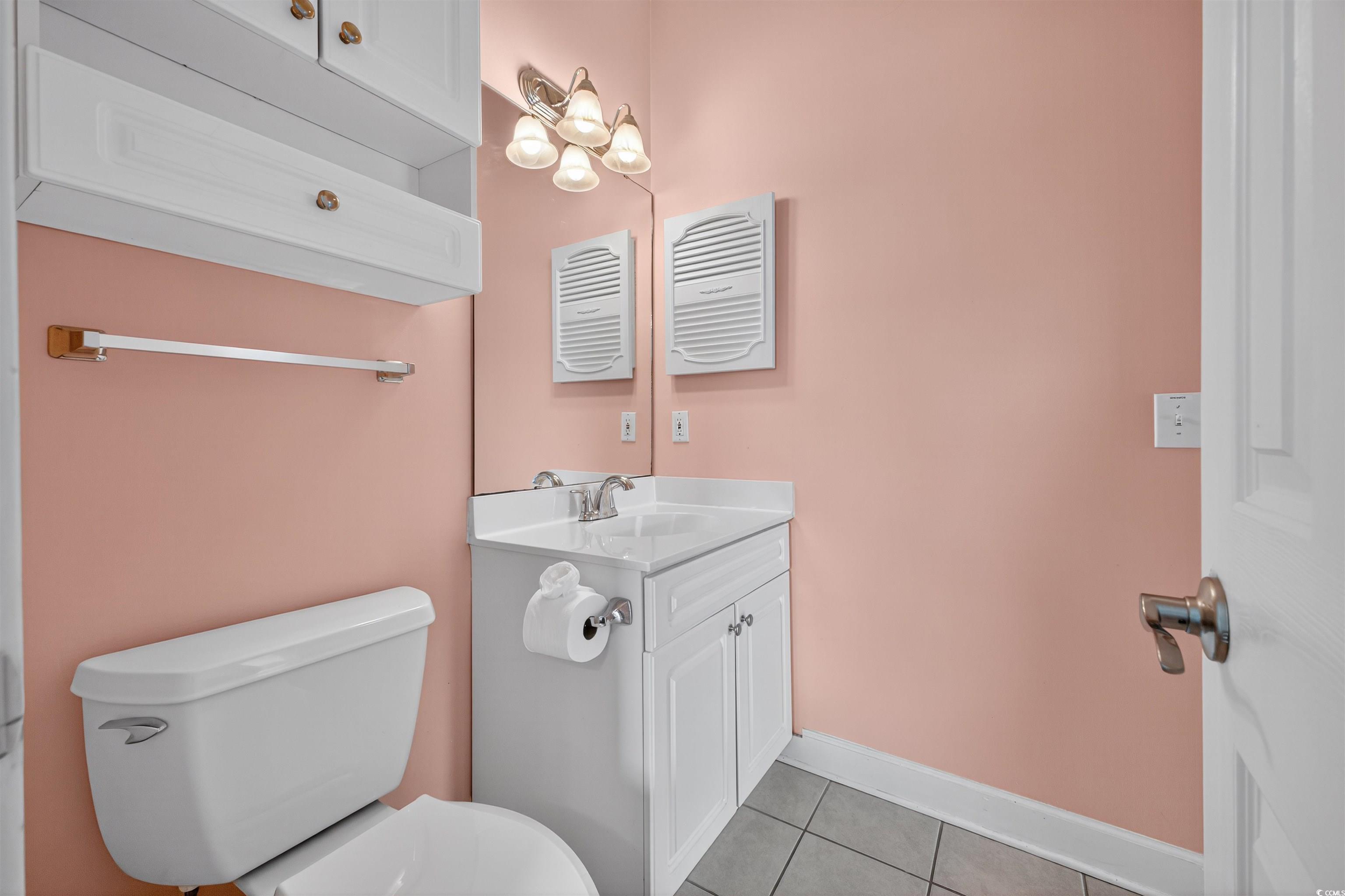 4673 Wild Iris Drive, Unit 204 Myrtle Beach, SC 29577 - Photo 16 of 20 Bathroom with light tile patterned floors and vani