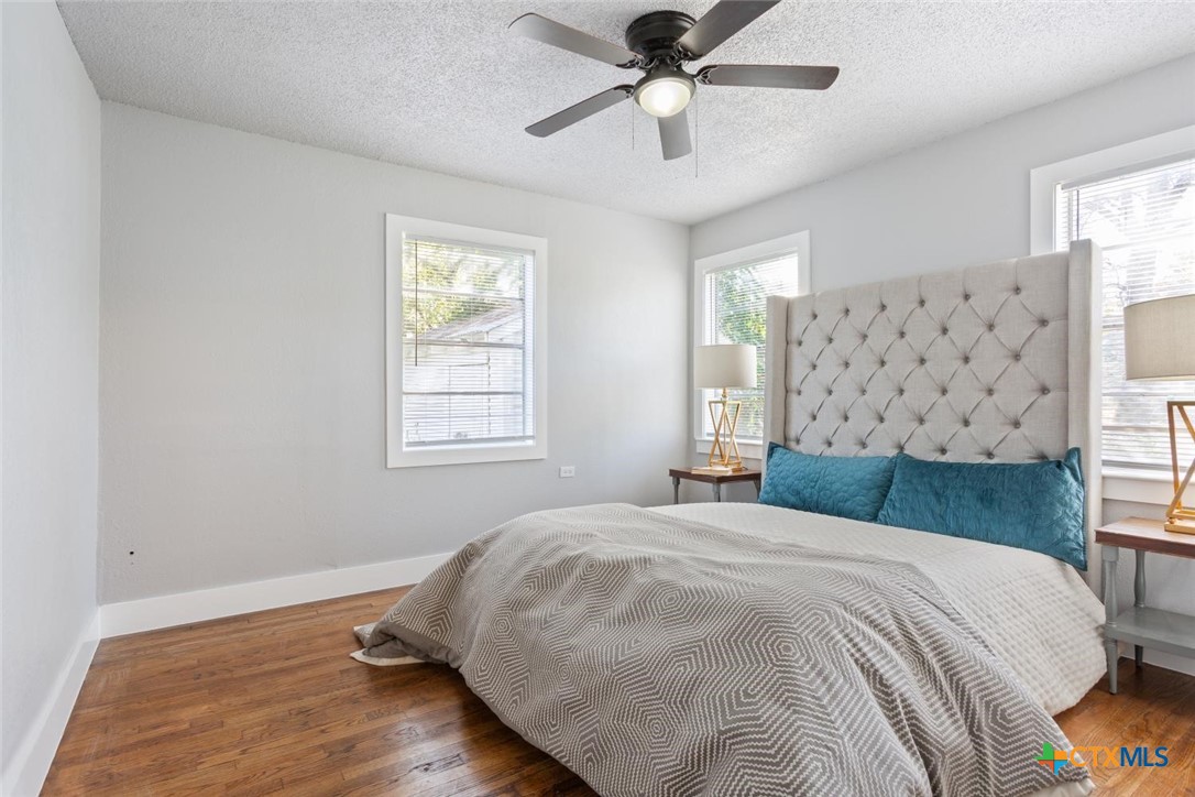 811 North 6th Street Temple, TX 76501 - Photo 14 of 23 a bedroom with a large bed and a window