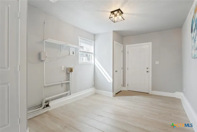 a view of a house with a yard porch and sitting area