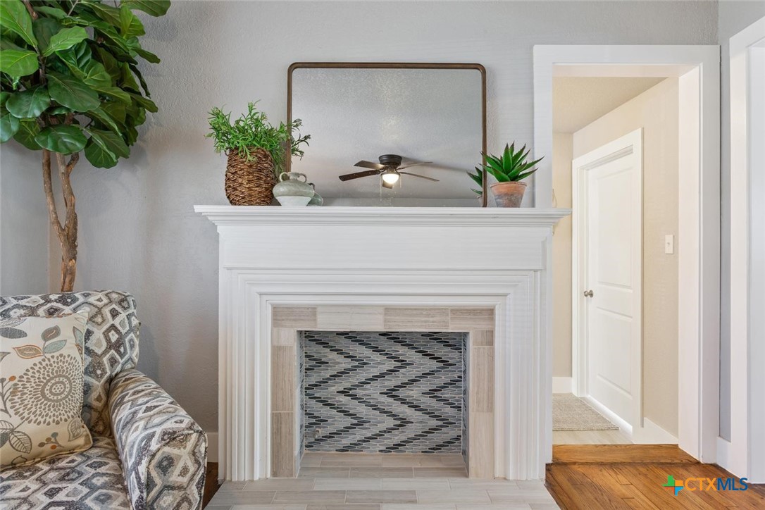 811 North 6th Street Temple, TX 76501 - Photo 7 of 23 a living room with a fireplace and potted plant
