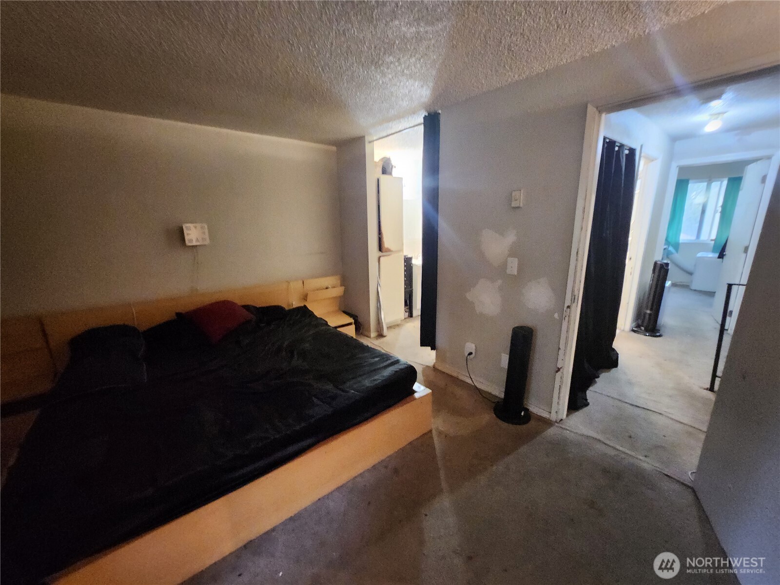 2019 Southwest 318th Place, Unit 4C Federal Way, WA 98023 - Photo 17 of 23 a bedroom with a bed and a mirror