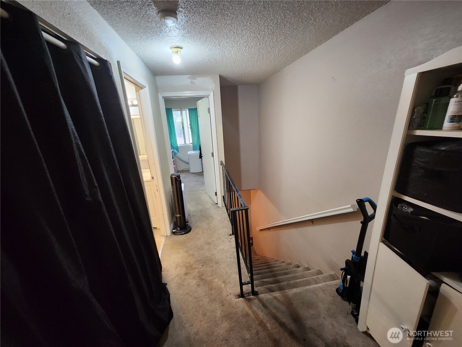 2019 Southwest 318th Place, Unit 4C Federal Way, WA 98023 - Photo 18 of 23 a view of a hallway with wooden floor and stairs