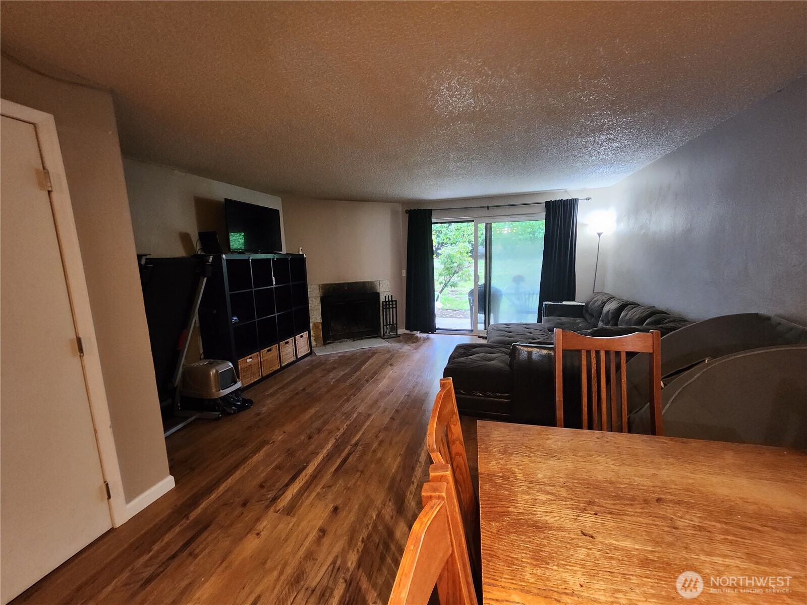 2019 Southwest 318th Place, Unit 4C Federal Way, WA 98023 - Photo 2 of 23 a bedroom with a bed and wooden floor
