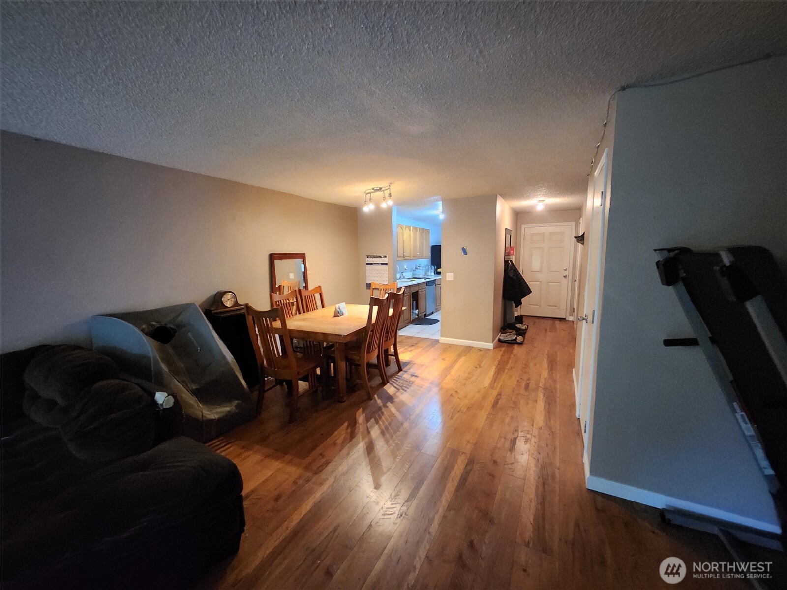2019 Southwest 318th Place, Unit 4C Federal Way, WA 98023 - Photo 3 of 23 a living room with furniture and a wooden floor