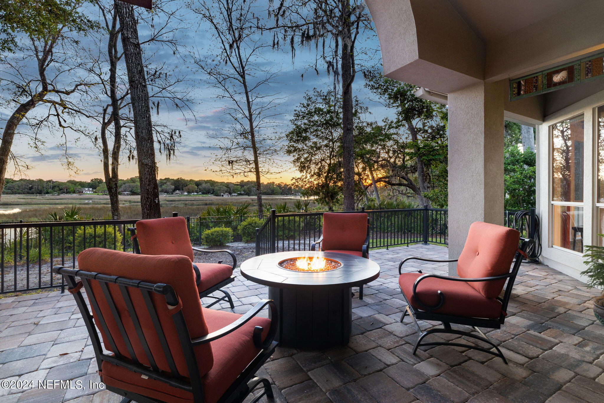 a view of a patio with furniture and a grill
