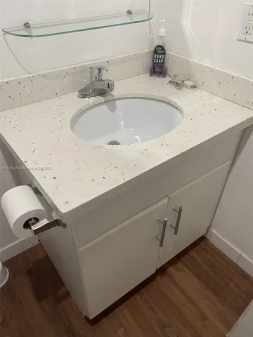 a bathroom with a mirror and a shower curtain