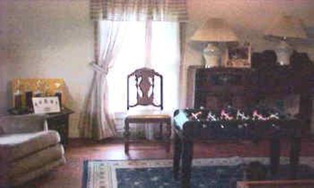 20478 Crosby Road Morrison, IL 61270 - Photo 2 of 7 a view of living room with furniture and a chandelier
