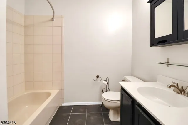 a bathroom with a sink a toilet and bathtub