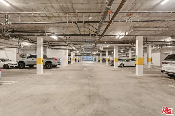 a view of parking garage with cars