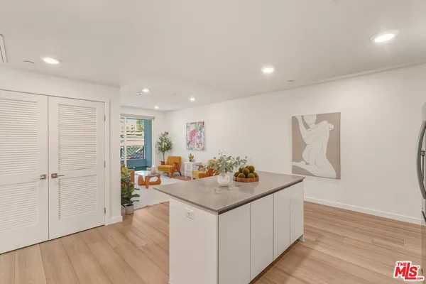 a view of kitchen island with furniture and wooden floor
