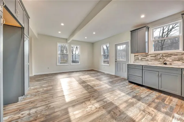 a view of a kitchen with a sink and cabinets