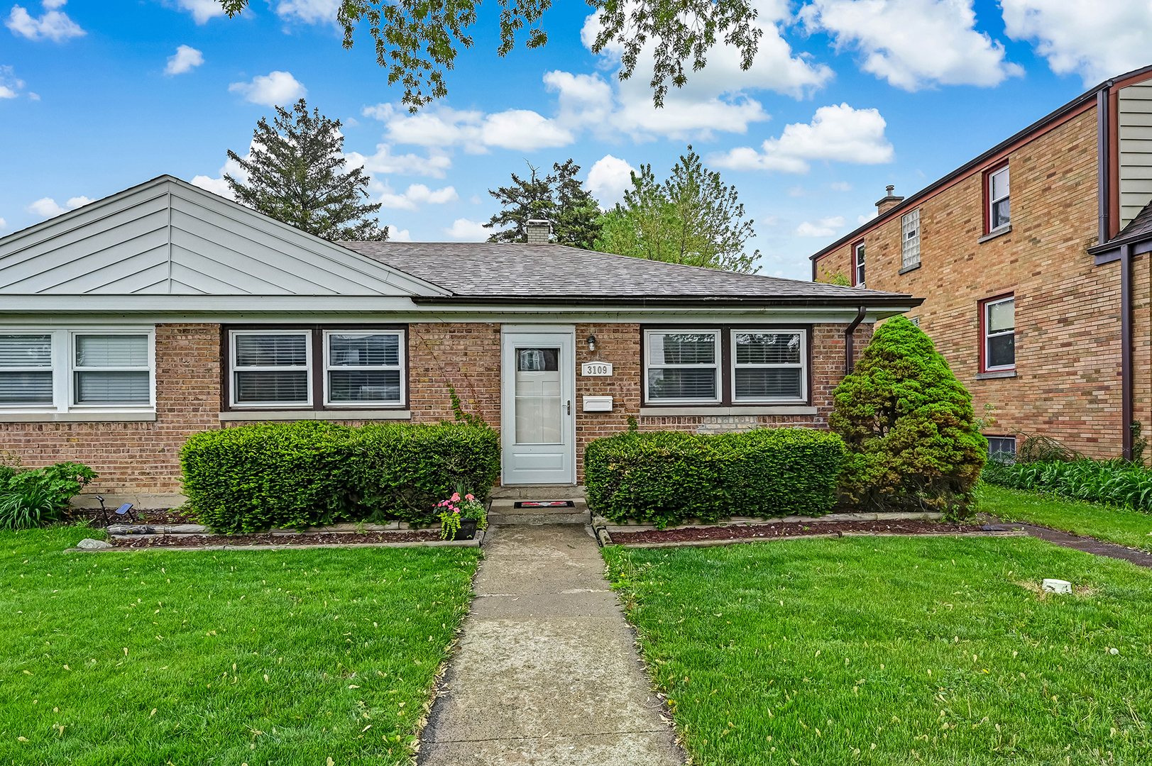 a front view of a house with a yard