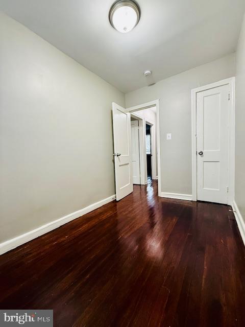 4809 Wilern Avenue Baltimore, MD 21215 - Photo 15 of 18 a view of empty room with wooden floor and window