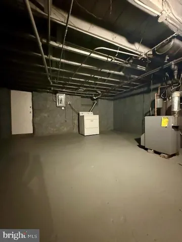 a view of a yard with wooden fence