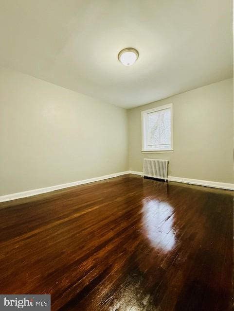 4809 Wilern Avenue Baltimore, MD 21215 - Photo 9 of 18 a view of room with window and wooden floor