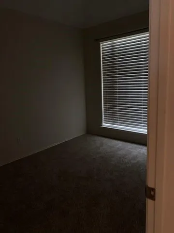 a view of a room that has a window in it