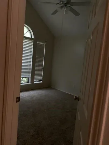 a view of empty room with windows