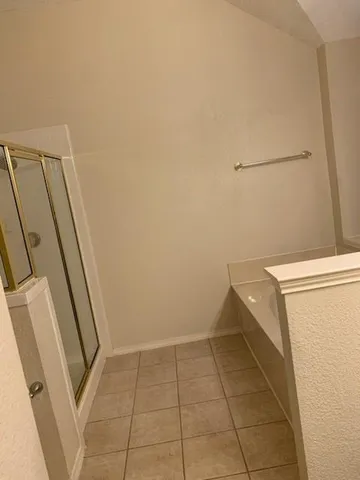 a view of a storage and utility room with washer and dryer