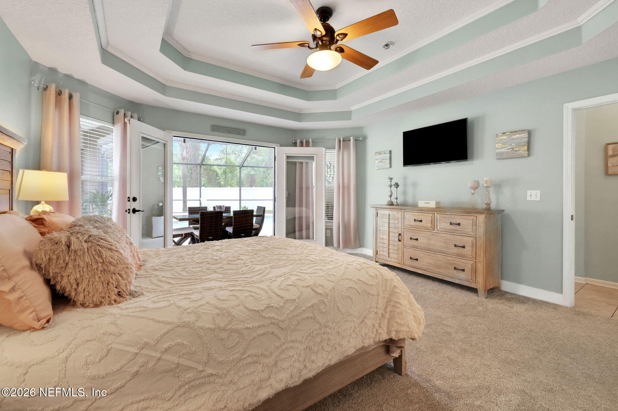 4320 Rye Court St. Johns, FL 32259 - Photo 29 of 60 a bedroom with a bed and a flat tv screen on dresser