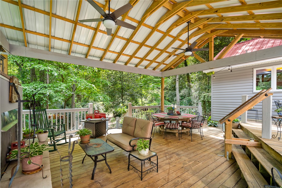 324 Hobson Road Anderson, SC 29621 - Photo 33 of 46 This spacious wooden deck offers serene views and a perfect setting for outdoor gatherings.