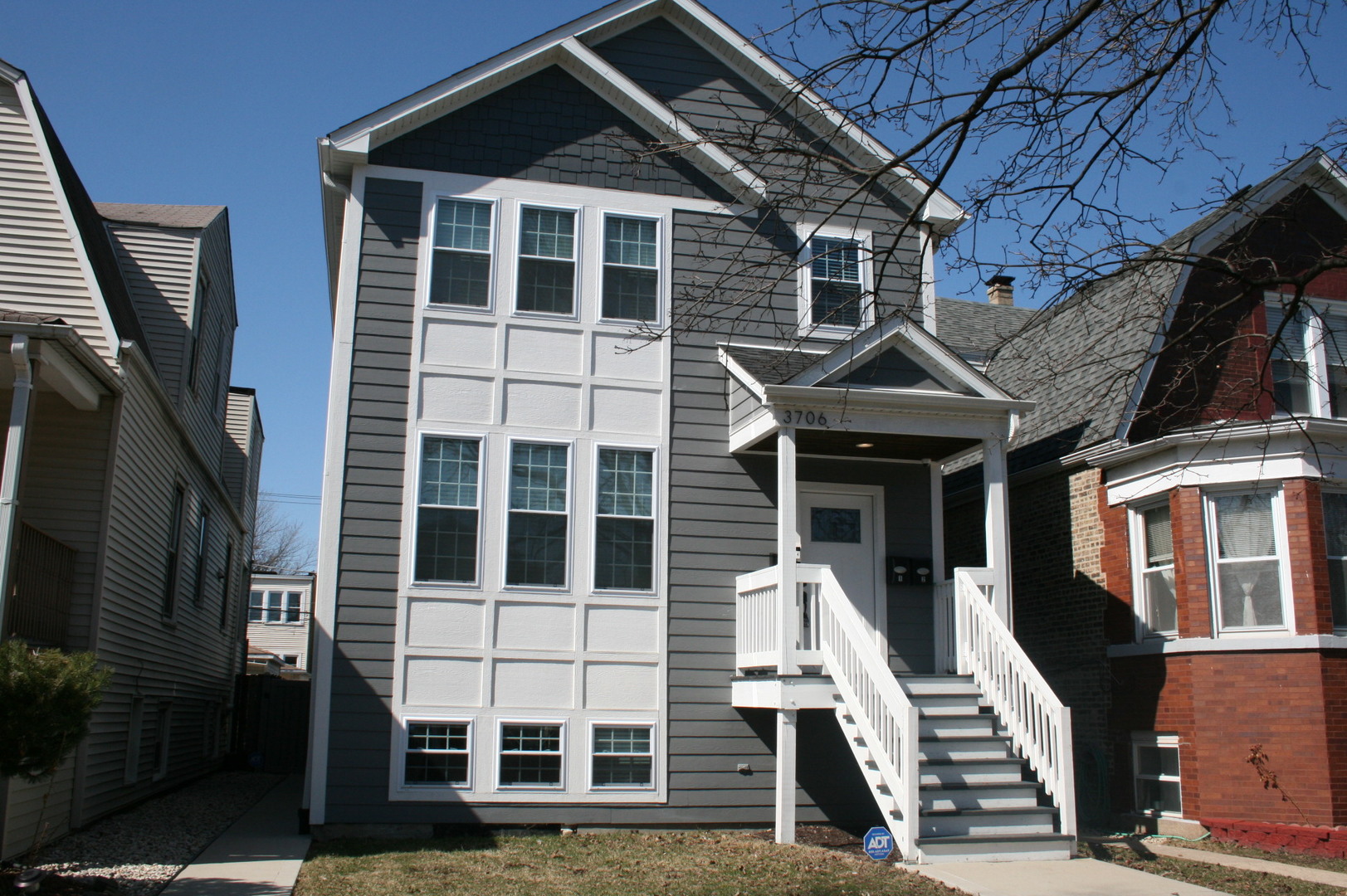a front view of a house with a large window
