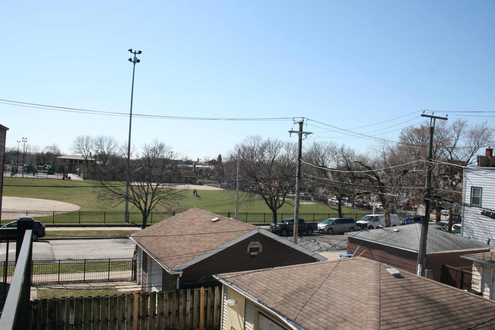 3706 North Drake Avenue, Unit G Chicago, IL 60618 - Photo 21 of 23 a view of a lake with a big yard and potted plants