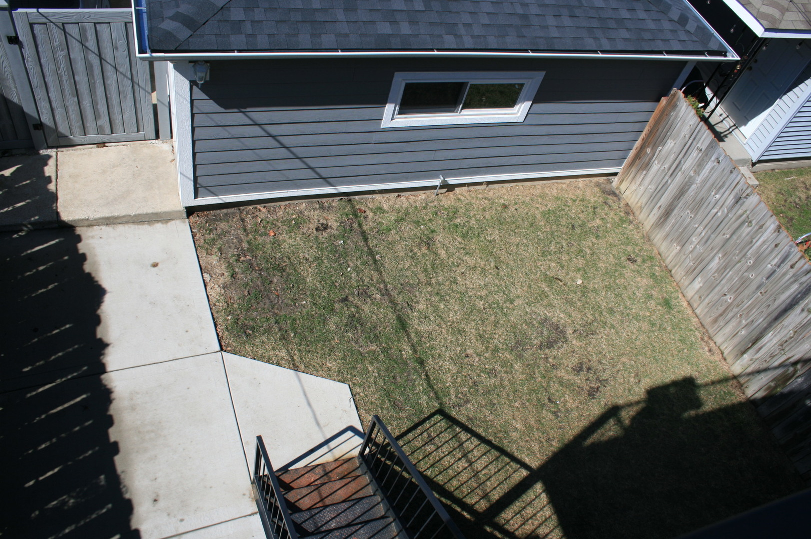 3706 North Drake Avenue, Unit G Chicago, IL 60618 - Photo 7 of 23 a view of a balcony with wooden floor and staircase