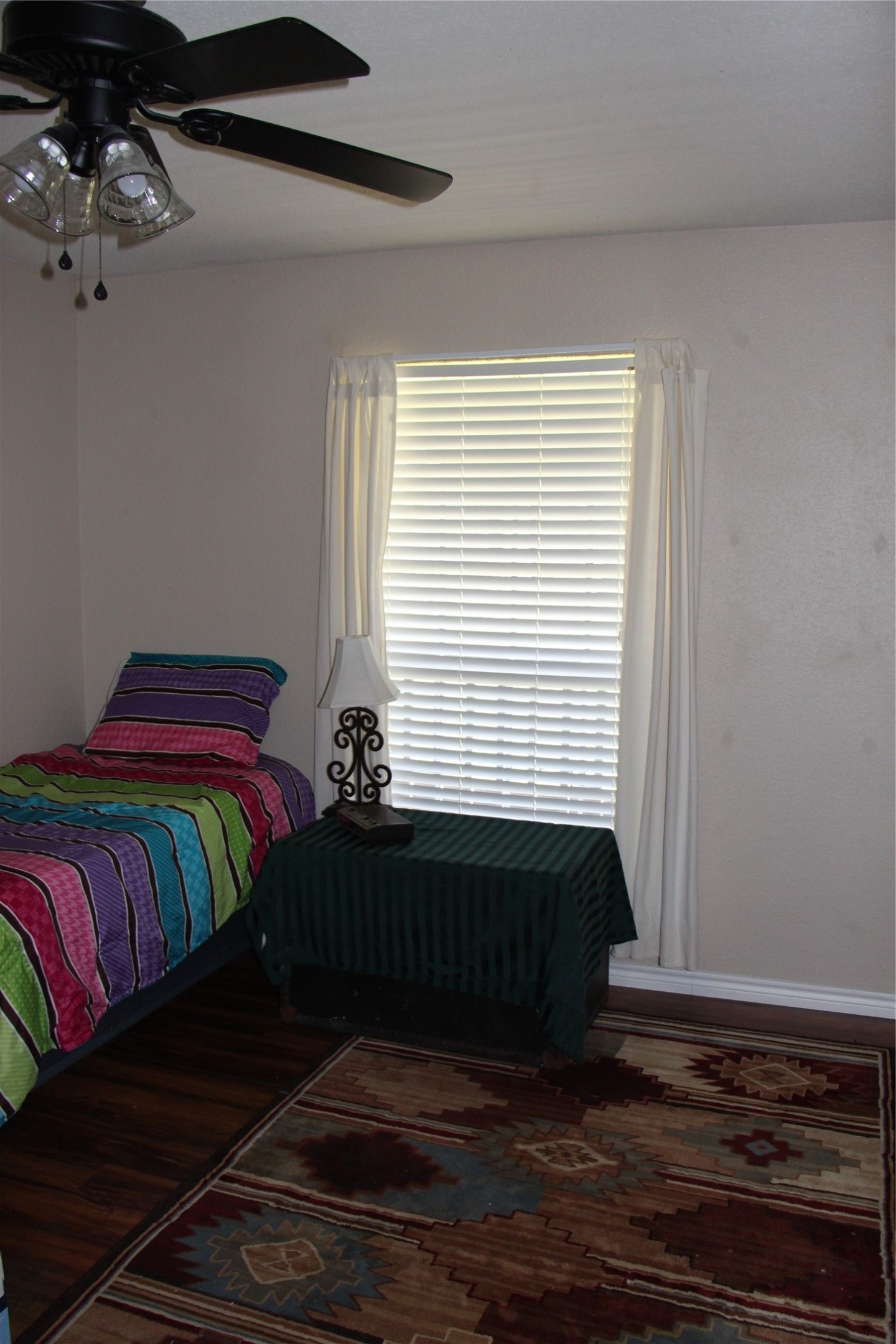 12710 Dannhaus Road Needville, TX 77461 - Photo 18 of 24 a bedroom with a bed and window