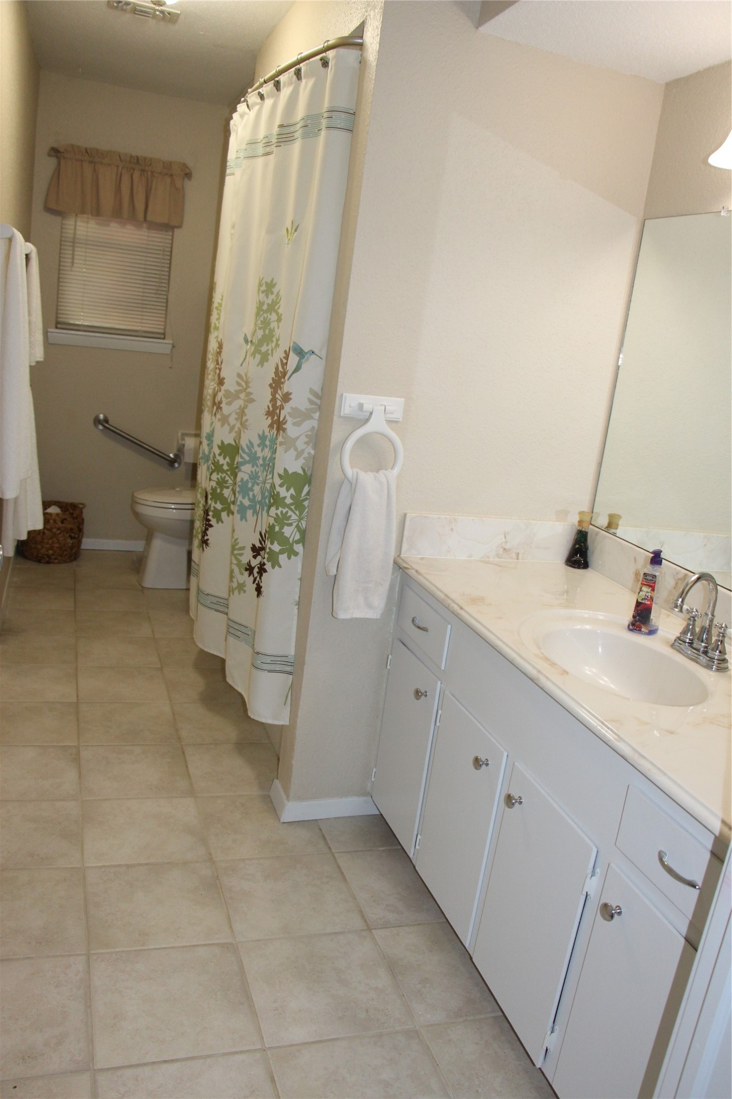 12710 Dannhaus Road Needville, TX 77461 - Photo 19 of 24 a bathroom with a double vanity sink and a mirror