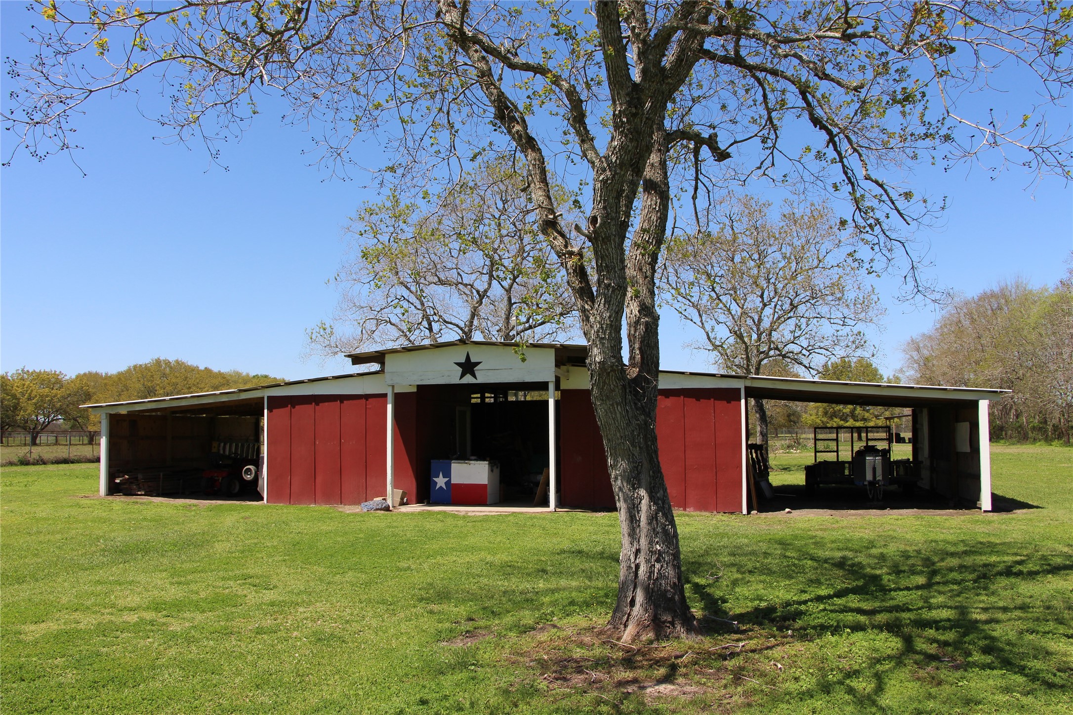 12710 Dannhaus Road Needville, TX 77461 - Photo 5 of 24 Barn with 3 stalls and 1 tack room. 2 overhangs to store equipment