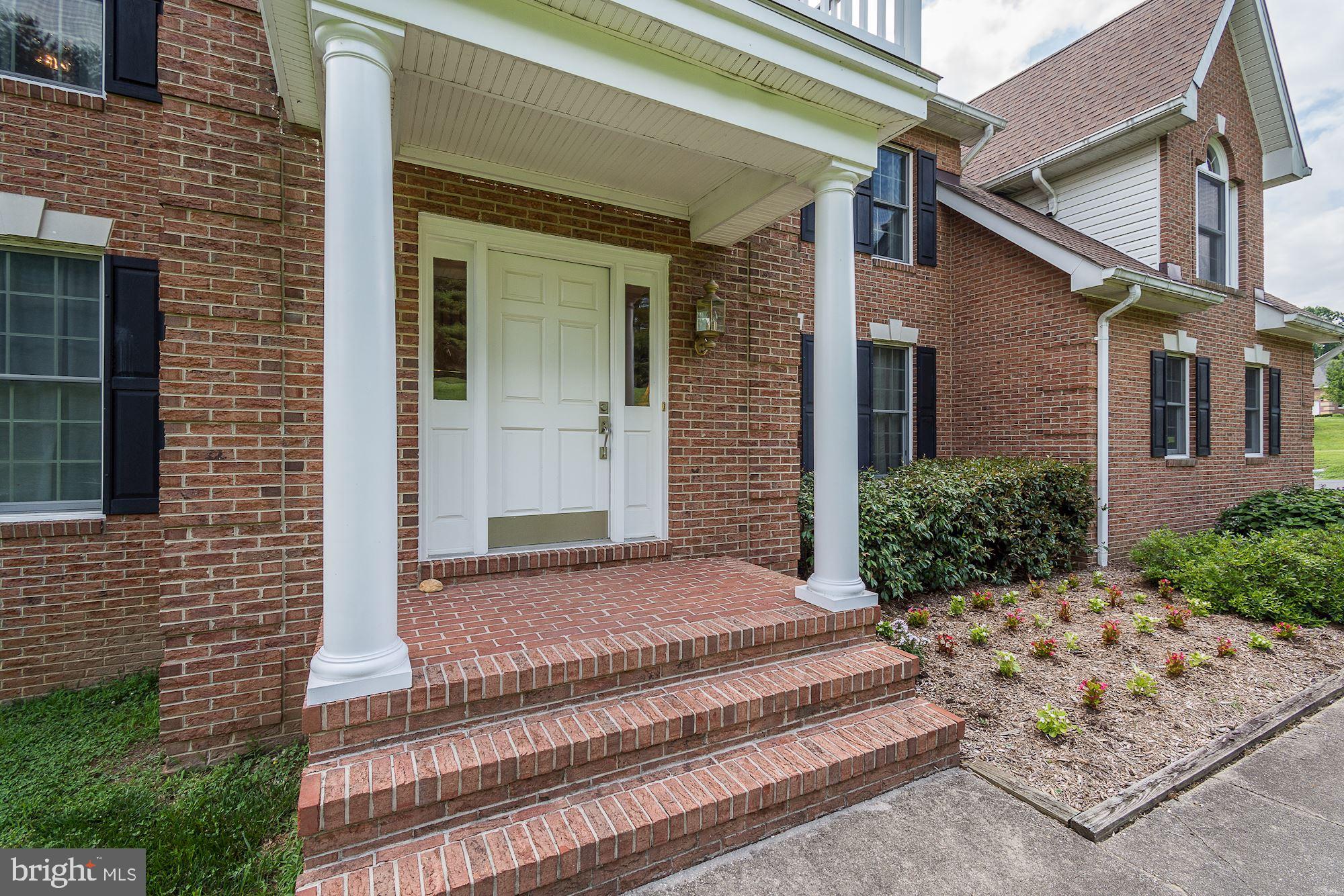 10920 Ward Road Dunkirk, MD 20754 - Photo 2 of 63 a front view of a house with garden