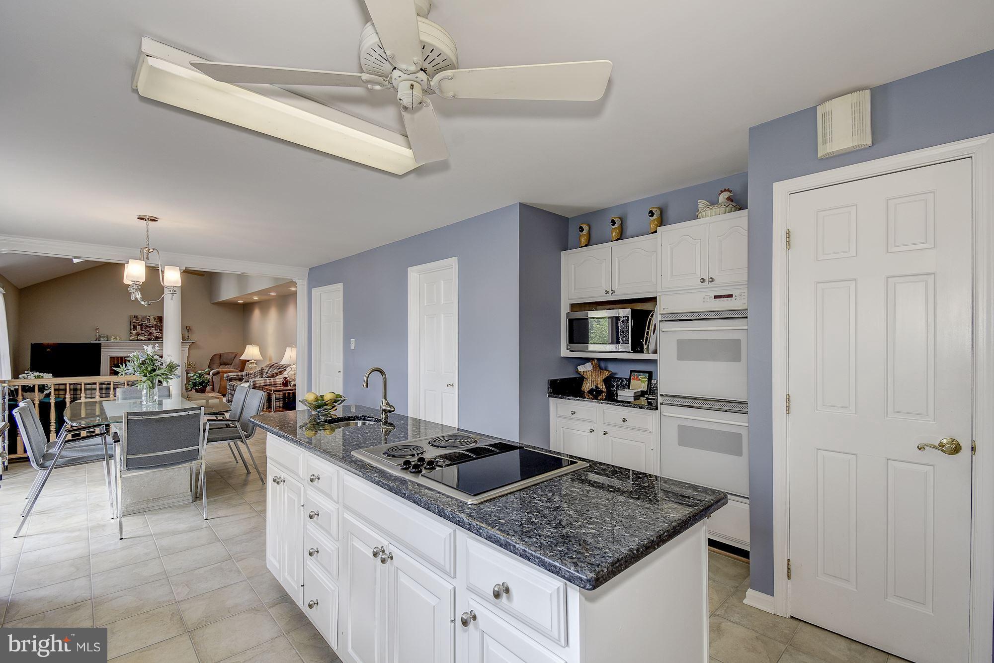 10920 Ward Road Dunkirk, MD 20754 - Photo 16 of 63 a kitchen with stainless steel appliances granite countertop a stove oven and a refrigerator with white cabinets