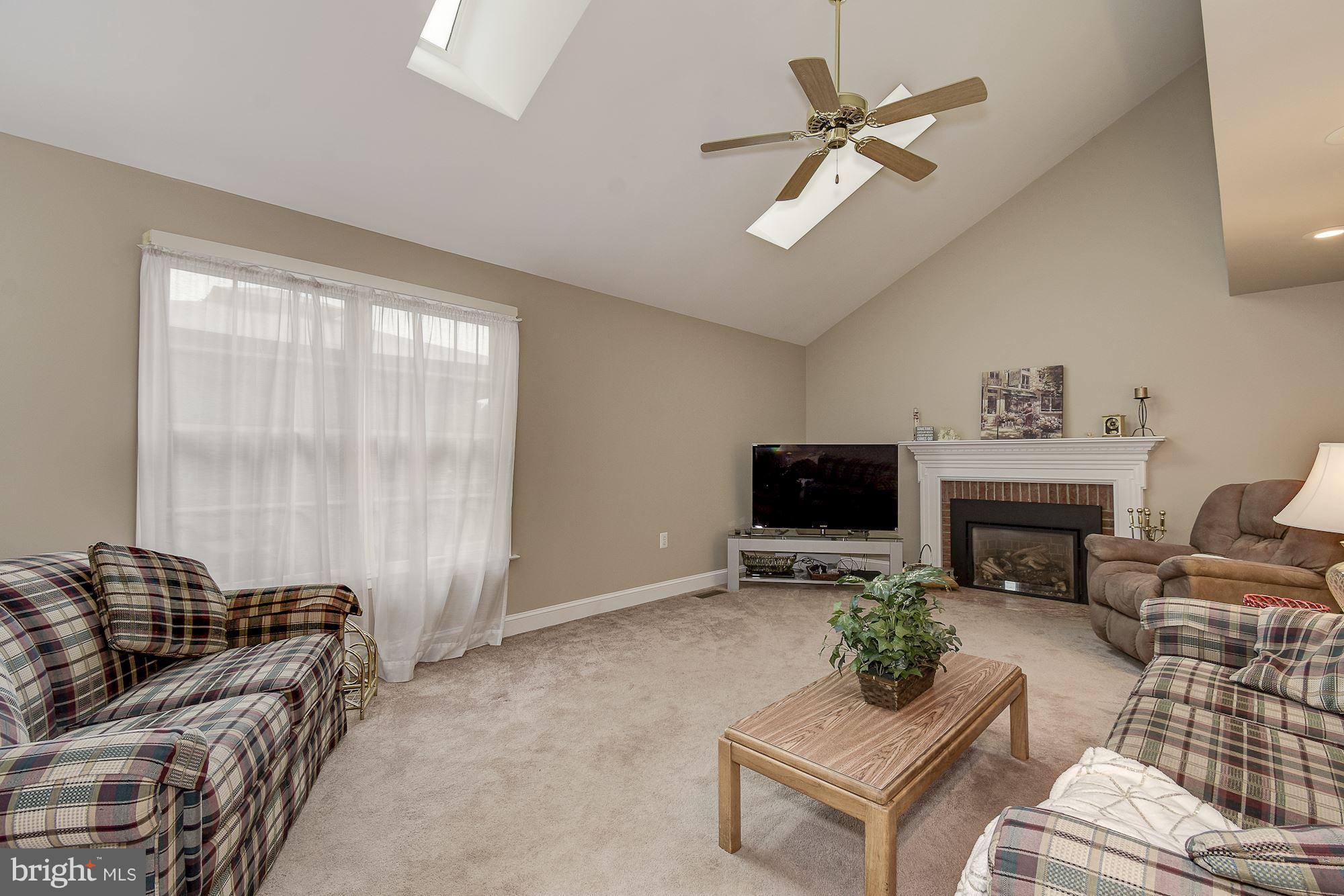 10920 Ward Road Dunkirk, MD 20754 - Photo 17 of 63 a living room with furniture ceiling fan and a window