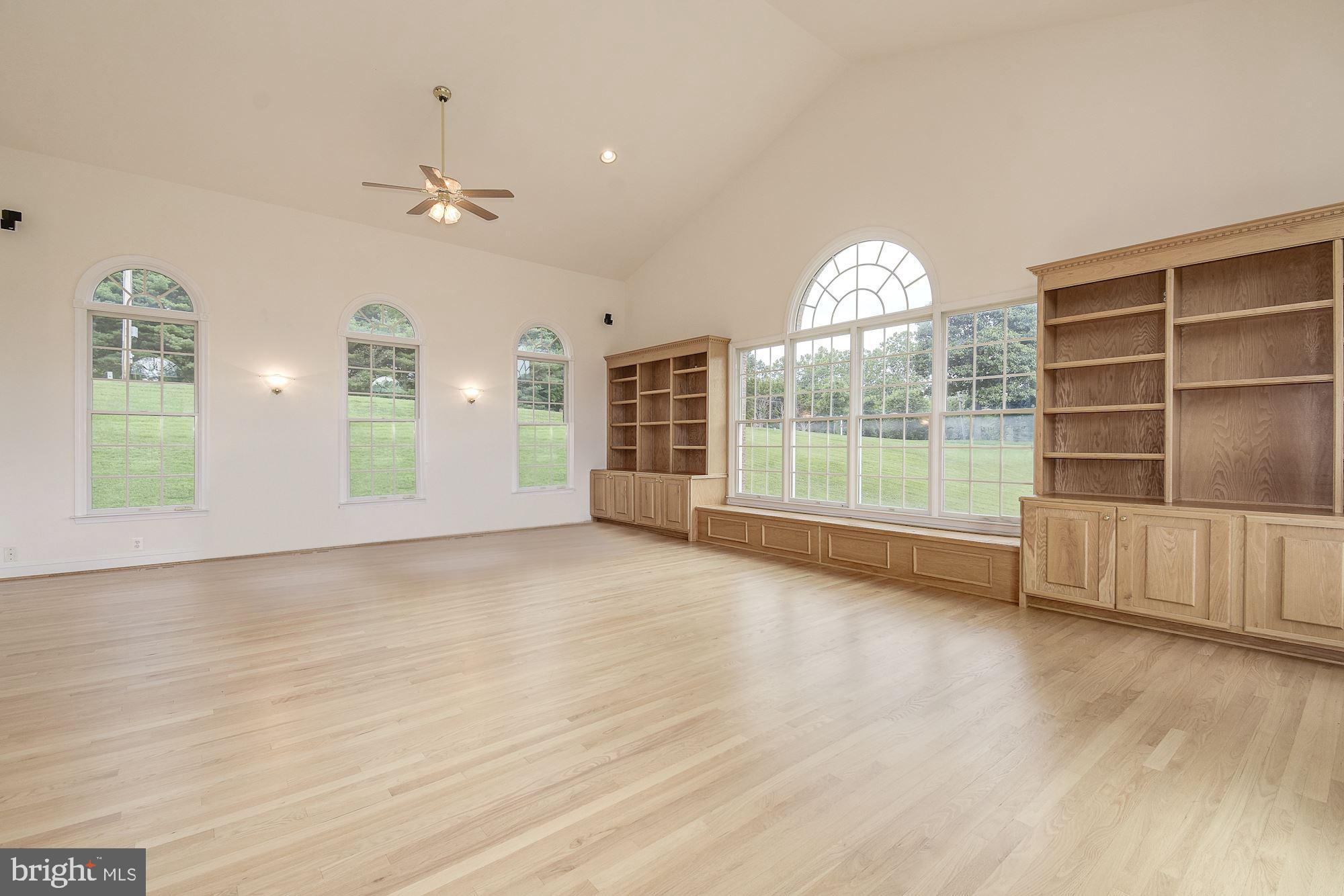 10920 Ward Road Dunkirk, MD 20754 - Photo 18 of 63 an empty room with wooden floor and windows