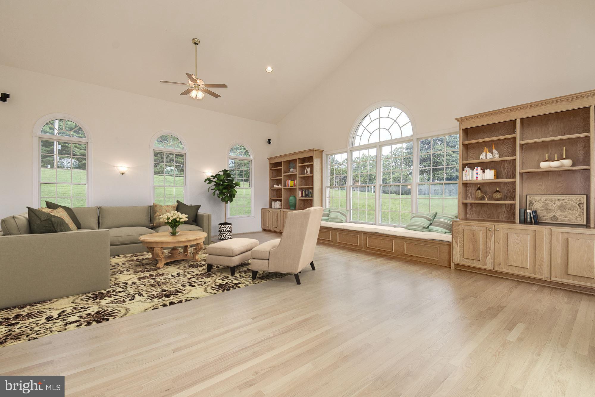 10920 Ward Road Dunkirk, MD 20754 - Photo 19 of 63 a living room with furniture and a large window