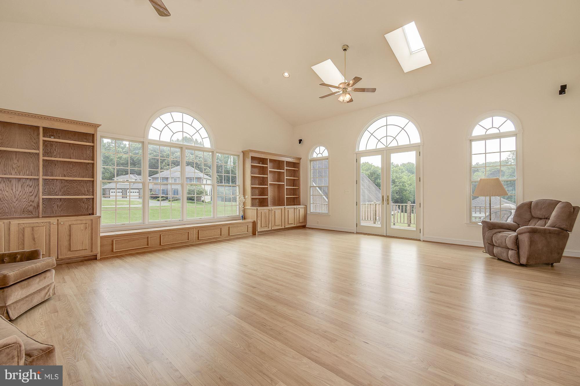 10920 Ward Road Dunkirk, MD 20754 - Photo 21 of 63 an empty room with wooden floor and windows