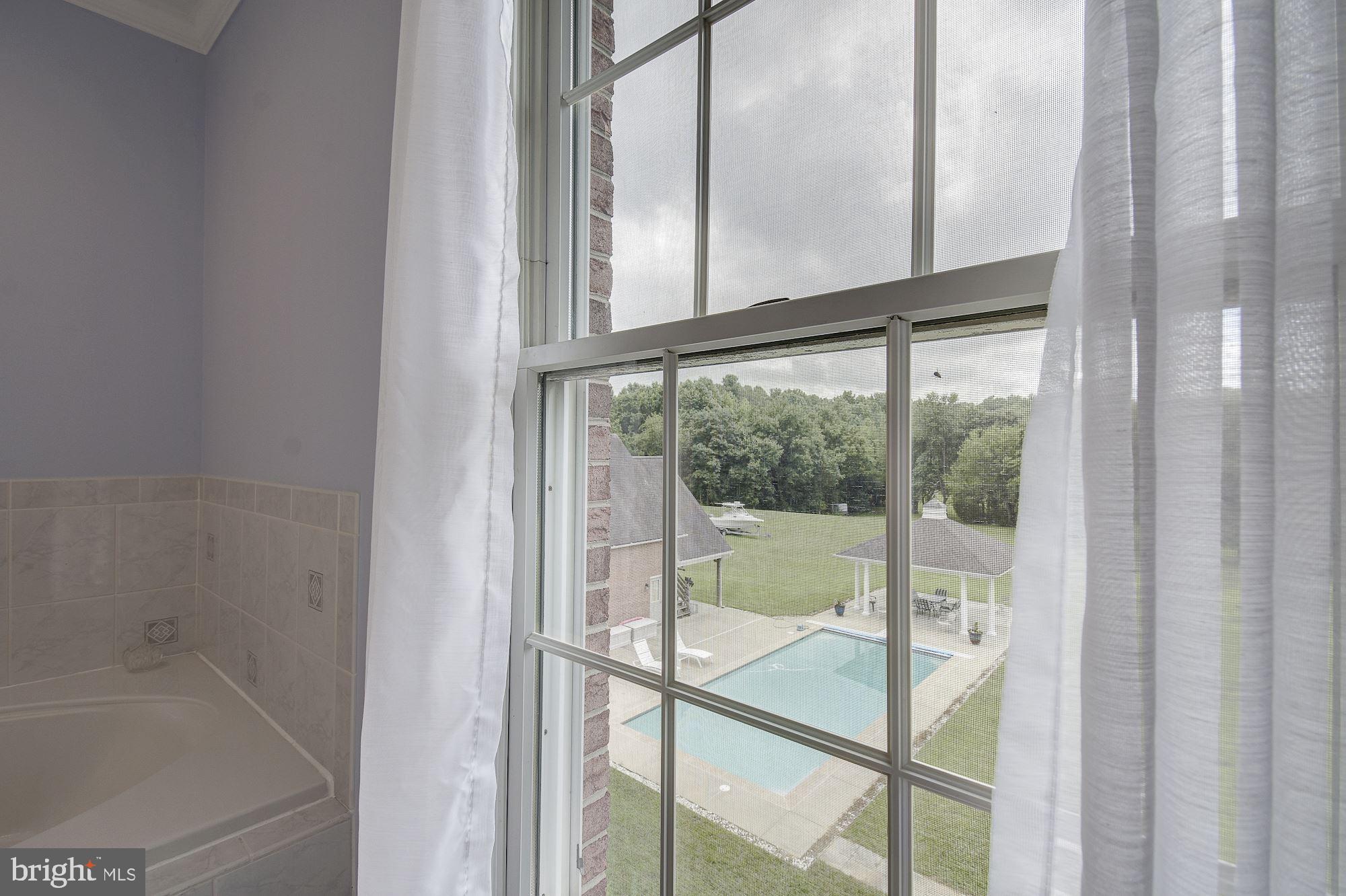 10920 Ward Road Dunkirk, MD 20754 - Photo 30 of 63 a view of a bathroom with a glass door