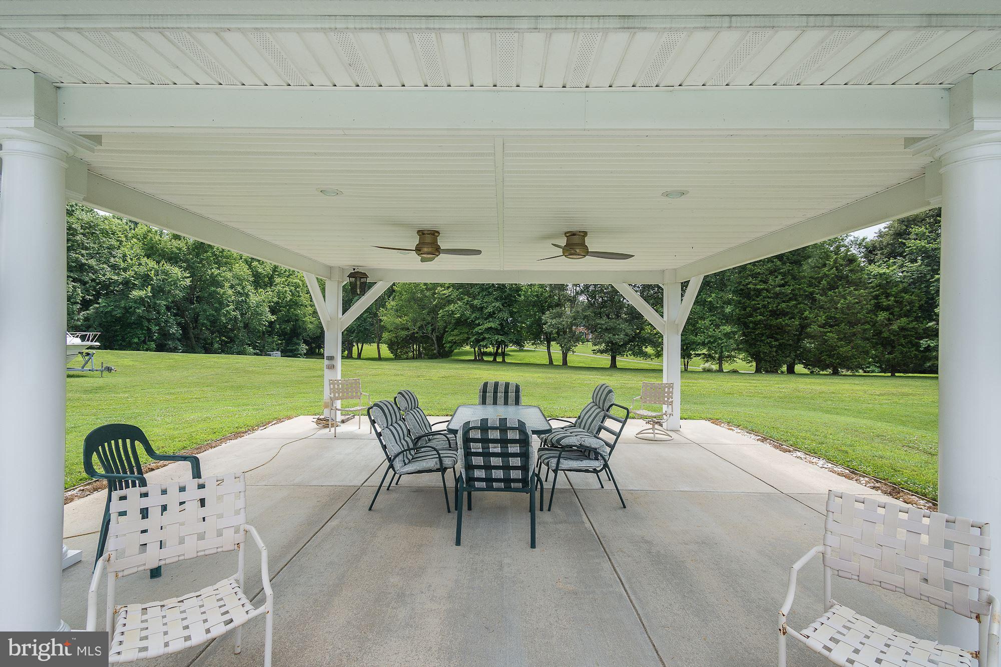 10920 Ward Road Dunkirk, MD 20754 - Photo 4 of 63 a view of a patio with a table chairs and a backyard