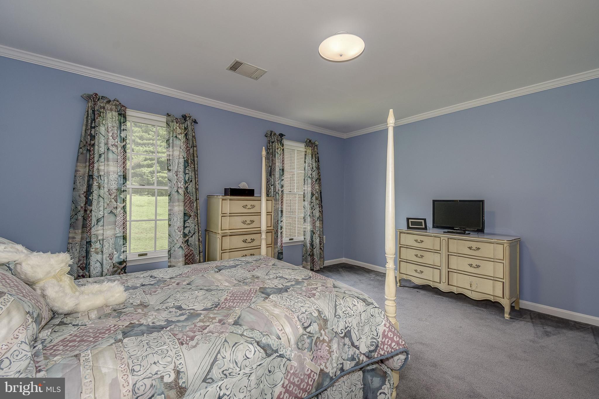 10920 Ward Road Dunkirk, MD 20754 - Photo 31 of 63 a bedroom with a bed and a television