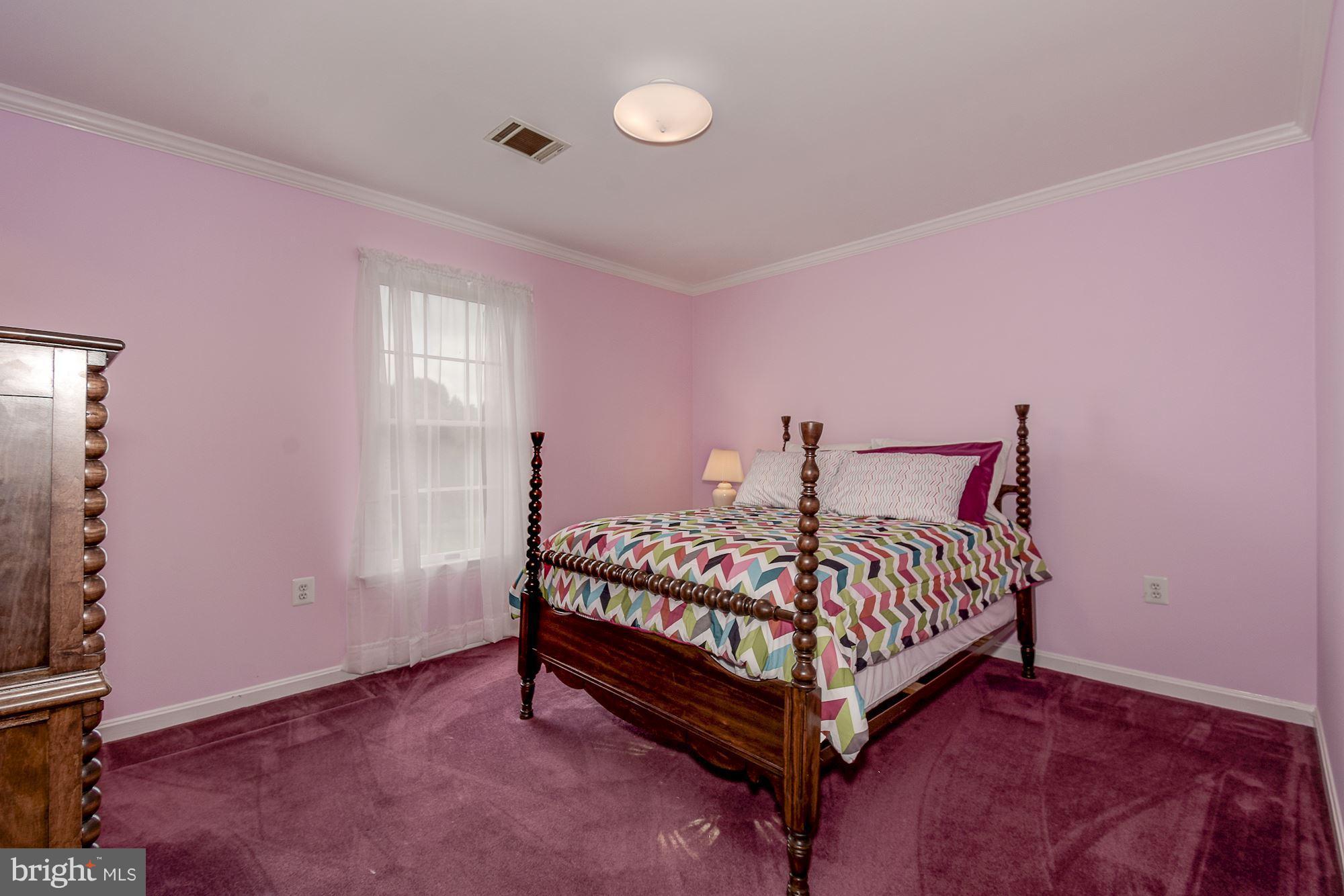 10920 Ward Road Dunkirk, MD 20754 - Photo 33 of 63 a bedroom with a bed and a window