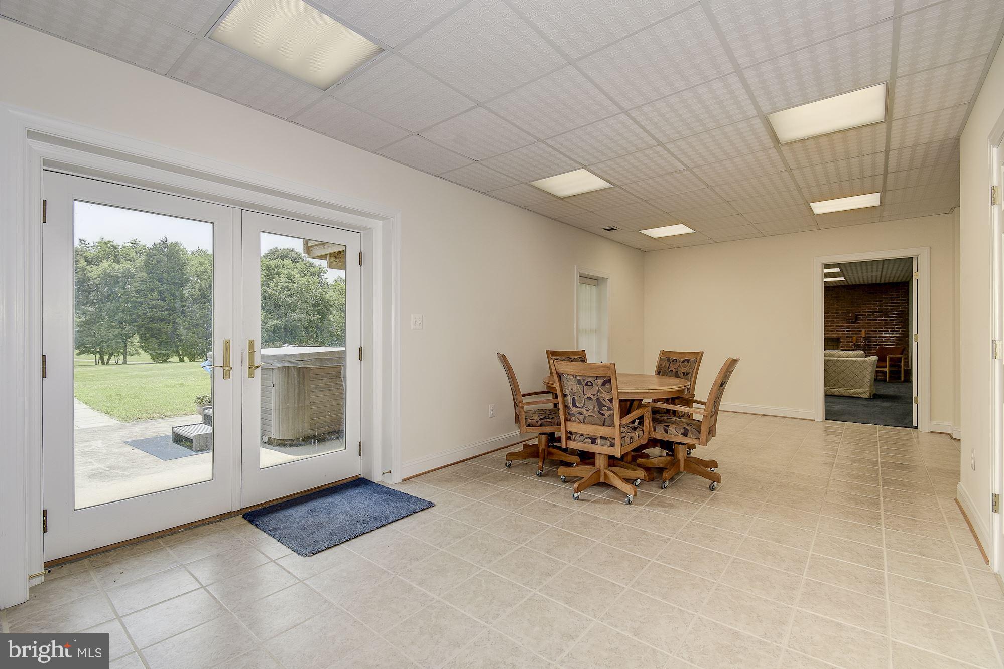 10920 Ward Road Dunkirk, MD 20754 - Photo 37 of 63 a view of a work space with furniture and front door